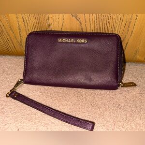 Michael Kors Plum Wristlet with Gold Details